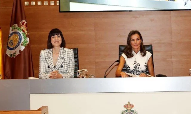 Queen Letizia wore an embroidered short sleeve dress by Felipe Varela. Professors Elena García Armada and Ana Conesa Cegarra