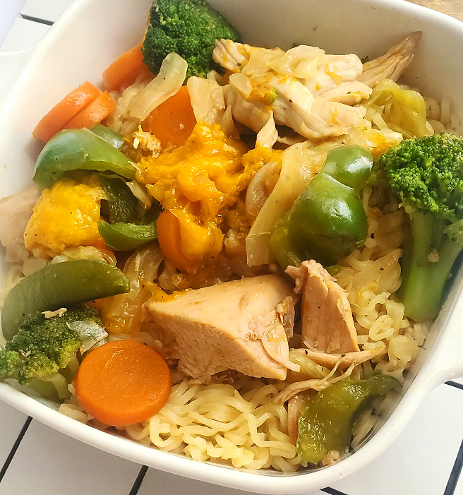 chicken with mango in a stir fry of vegetables