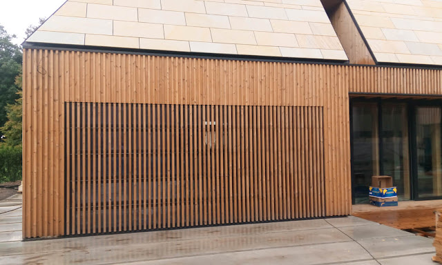 Glazed garage door clad in 'louvre' style