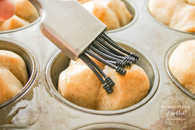 Brushing butter on the rolls