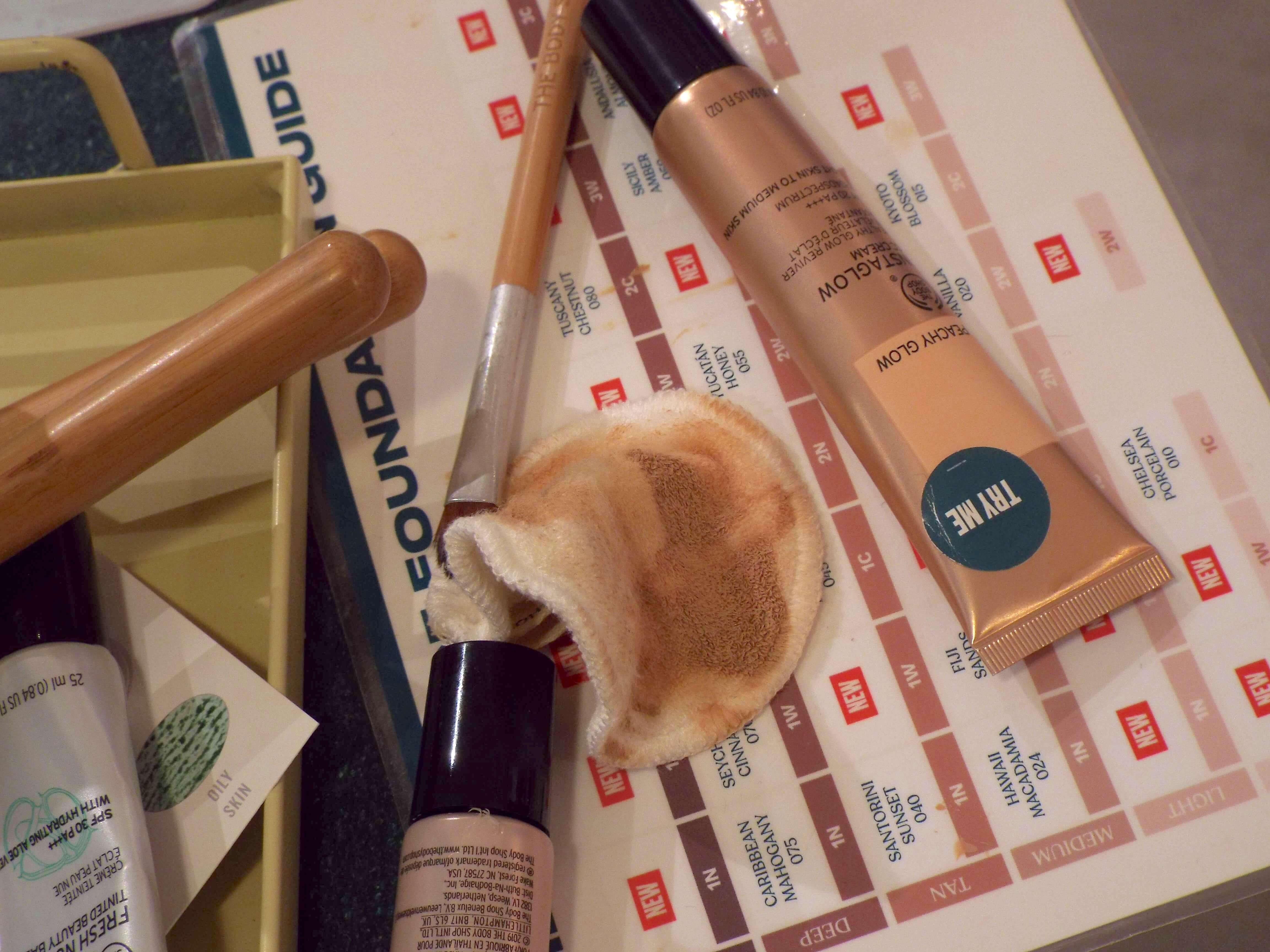 A scattered of beauty products on the makeup counter, where the makeup consultations were taking place, including the Peachy Glow Instaglow CC Cream.