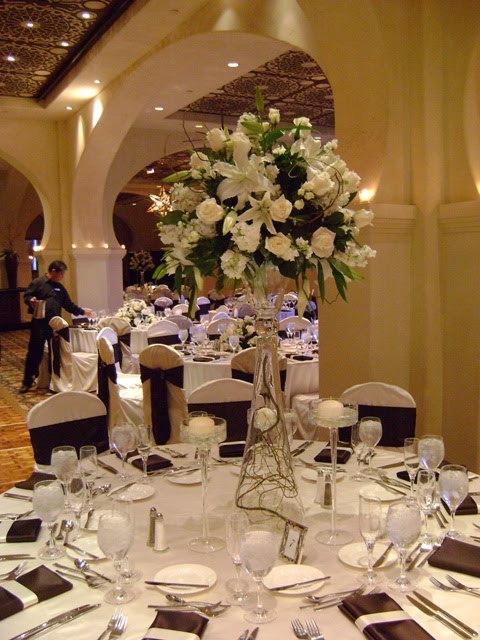 Adorning each table centerpiece were votive candles and floating candles 