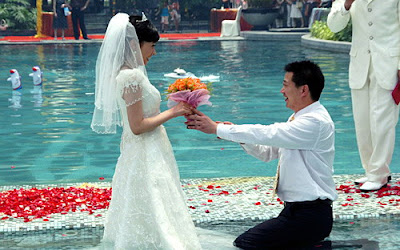 Chinese Couple  Holding Wedding Ceremony in Swimming Pool