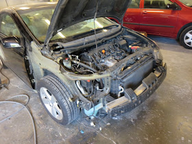 Honda Civic in process of collision repairs at Almost Everything Auto Body.