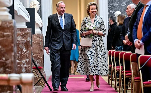 Queen Mathilde wore a Monki jacquard with embroidery motif midi dress by Natan. Professor Isabel Beets