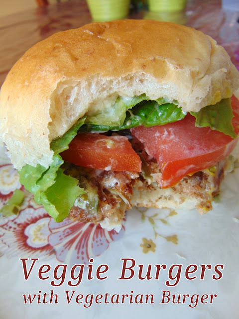 Veggie Burger with Vegetarian Burger in a bun with lettuce, tomato and condiments.