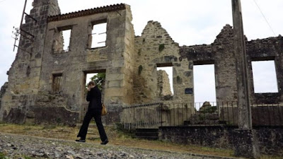 Oradour-sur-Glane France Nazi massacre memorial graffiti war crime genocide