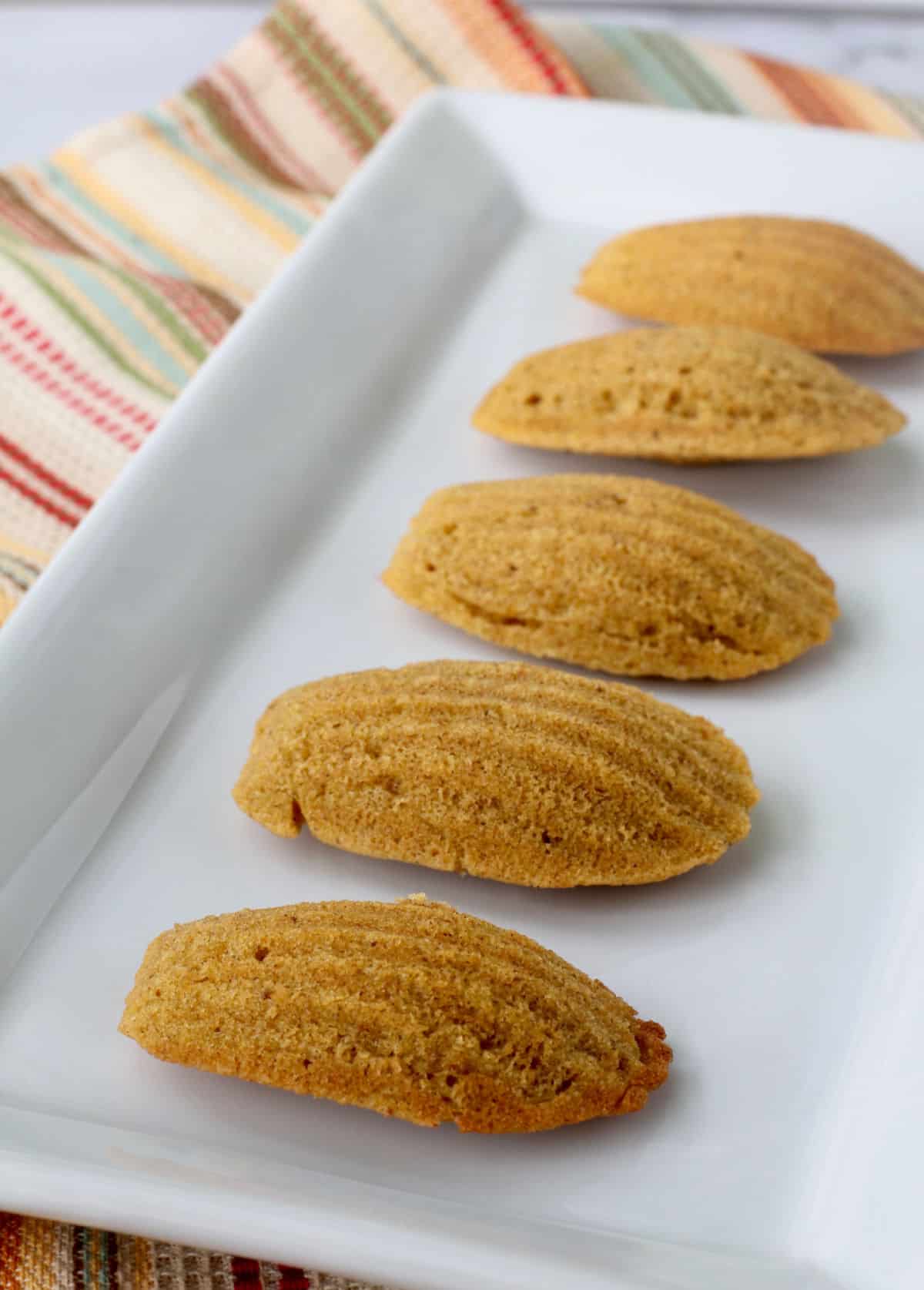 Pumpkin Madeleines on a white long serving plate.