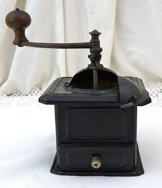 Photo of a vintage black toleware coffee grinder on Etsy.