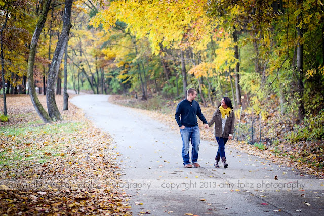 a couple walking through Fowler Park in Terre Haute in the fall - Terre Haute photographer