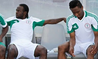 GETTING READY … Super Eagles duo, Victor Moses (l) and Obi Mikel on   reserve bench in readiness for action todaystalk.com.ng