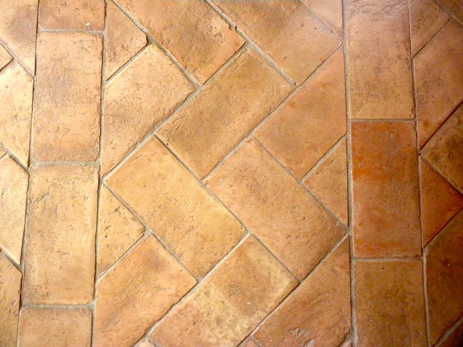 hand made terracotta floor tiles laid in herringbone ( spina reale ...