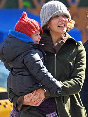 Maggie Gyllenhaal totes 2-year-old Ramona as she makes her way to the 