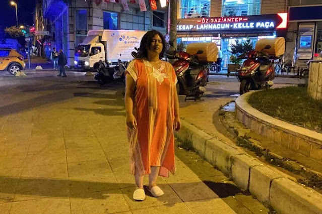 Woman stands still on sidewalk in Istanbul for 5 hours
