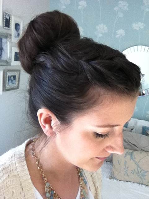Bun and side plait hairstyle