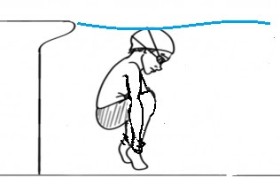 Image of a boy grabbing his ankles under water. Another of the games for swimming lessons