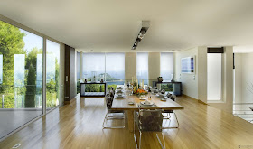 Large dining room with floor to ceiling windows