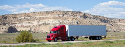 Semi-truck headed down highway, google image