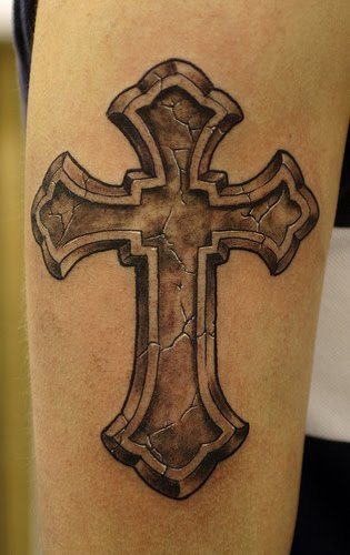 Cross tattoos are typically seen on the upper arm and across the back and