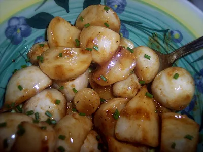 Serving bowl of maple mustard roasted baby turnips.