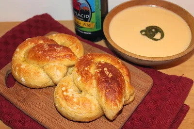 Soft pretzels with a bowl of cheddar-ale dipping sauce.