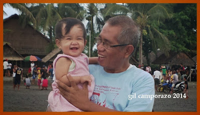 Inday Sophie laughing cuddled by her grandpa Gil