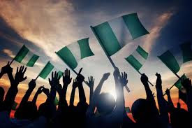 Hands of people holding the mini Nigeria  flags high