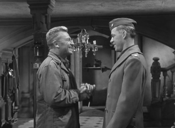 Eddie Albert shaking hands with Lee Marvin