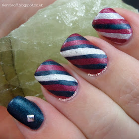 Red and Green candy cane nail art design.