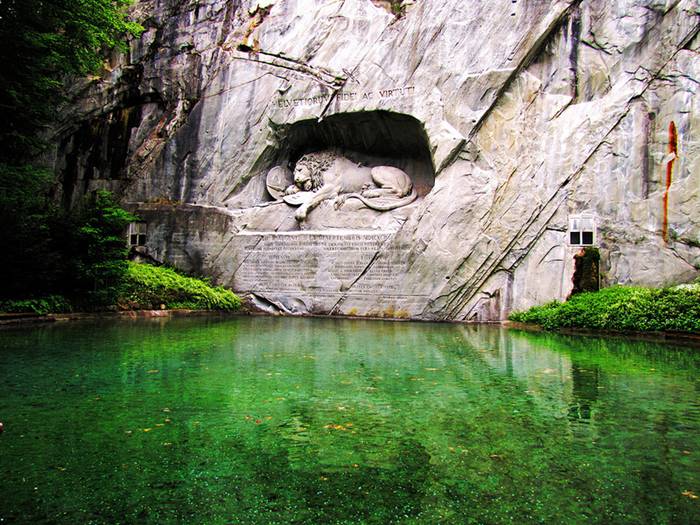 The Lion Monument, or the Lion of Lucerne, is a sculpture in Lucerne, Switzerland, designed by Bertel Thorvaldsen and hewn in 1820–21 by Lukas Ahorn. It commemorates the Swiss Guards who were massacred in 1792 during the French Revolution, when revolutionaries stormed the Tuileries Palace in Paris, France. Mark Twain praised the sculpture of a mortally-wounded lion as "the most mournful and moving piece of stone in the world."