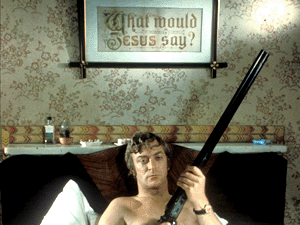 Michael Caine as Jack Carter, shirtless, holding a gun, Get Carter, Directed by Mike Hodges