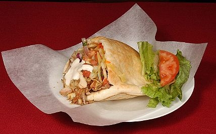 Chicken shawarma pita bread sandwich in a serving dish