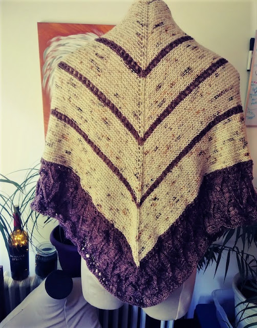 Simple garter stitch and lace shawl knit with fingering weight wool from Cozy Color Works.