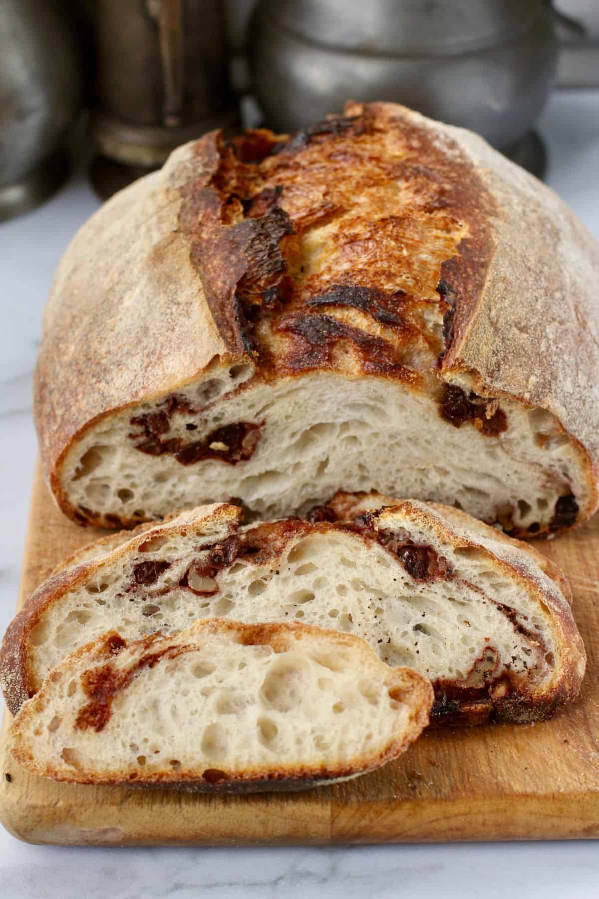 Cinnamon Raisin Sourdough Bread on a Cutting Board.