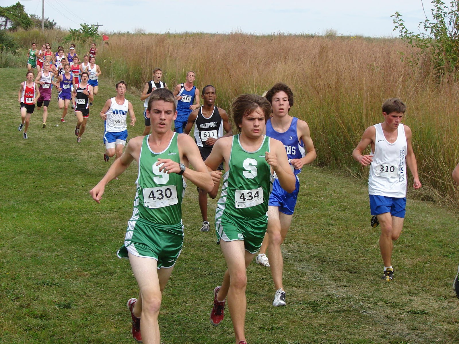 Bethany's Jesse Bontreger, second from right, runs in Saturday's West Noble Invitational. Photo from RunIndiana.com
