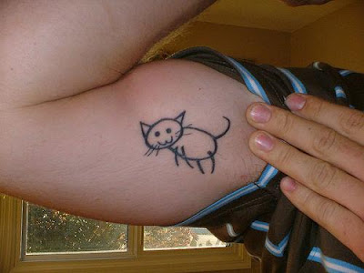 cat tattoo on belly. kitty cat tattoo