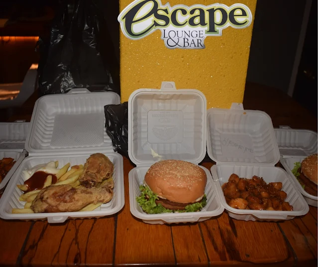 " Hamburger, chicken and fries, spicy chicken food from restaurant Escape in Paramaribo"