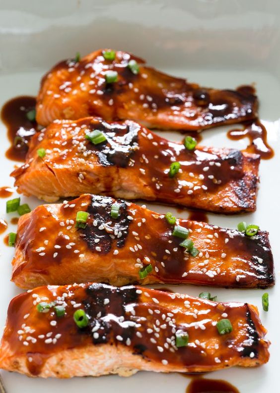 Sweet and Spicy Honey Sriracha Salmon. A super easy and healthy dinner. Serve with rice and veggies to make it a meal!