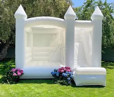 white bounce house with slide