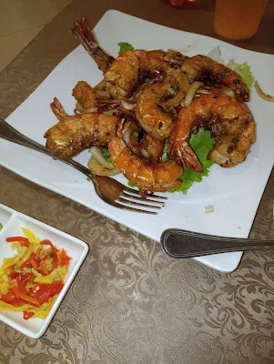 " Spicy garlic jumbo shrimp from Lucky Twins restaurant in Suriname"