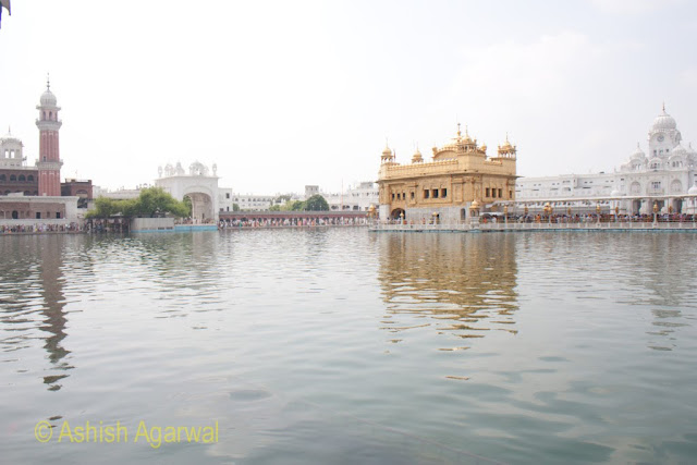 View of Darbar Sahib, minar of the Ramgarhia Bunga, and other structures inside the Golden Temple complex