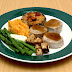 Pork medallions and vegetables.