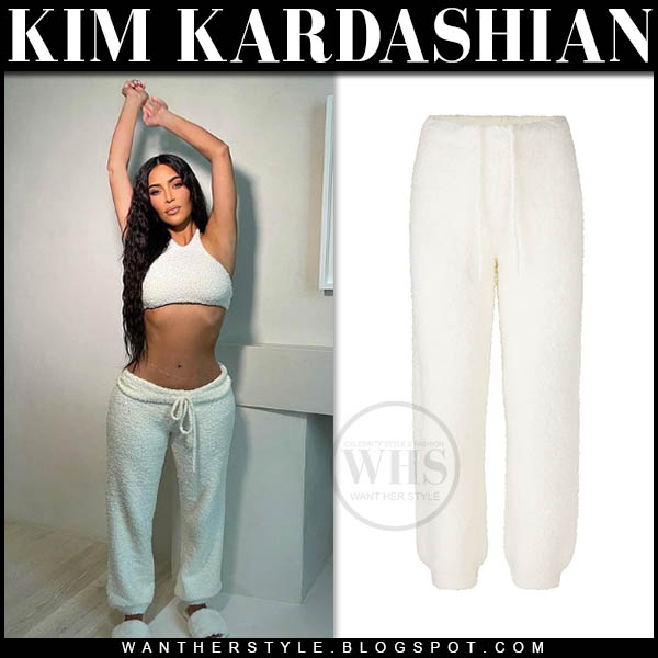 Kim Kardashian in white knit crop top and white knit sweatpants