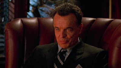 Ray Wise in red lighting, looking deliciously evil