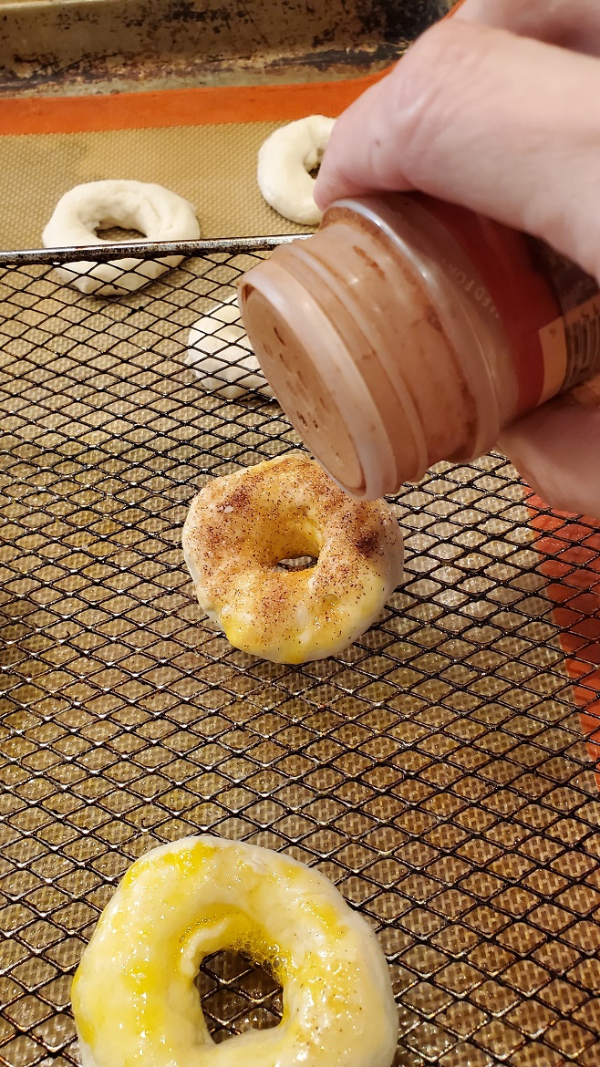 cinnamon sugar on top of air fryer donuts