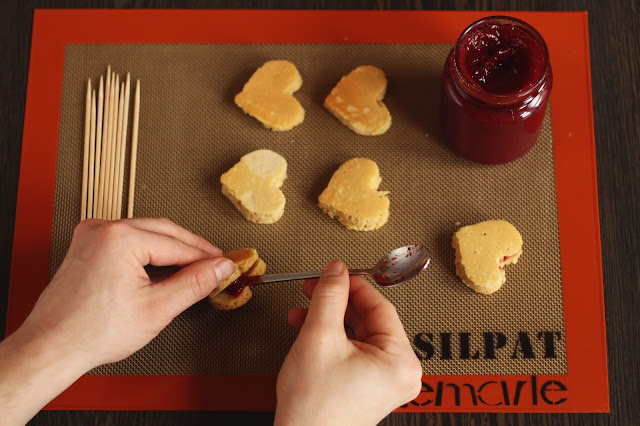 A Valentines Day Special from the German food blog Pancake Stories - peanut butter strawberry jelly pancake hearts in sticks sprinkled with rose petals and salt. That's the big romantic gesture you were looking for.