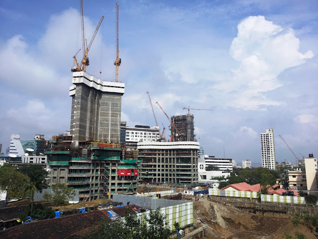 Photo of World One Skyscraper and other buildings around under construction