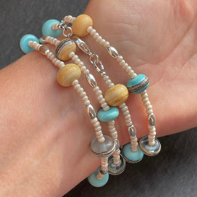 Handmade lamwork glass bead necklace as a wrap bracelet by Laura Sparling