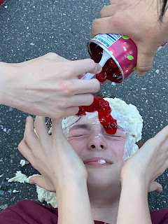 A boy with pie ingredients on his face