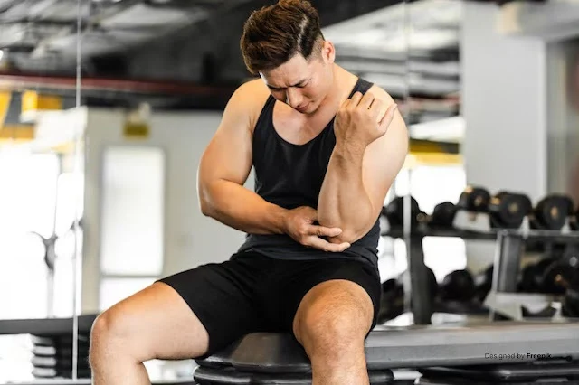 "Person holding their arm with a strained expression, representing muscle weakness and common causes like fatigue or poor nutrition"